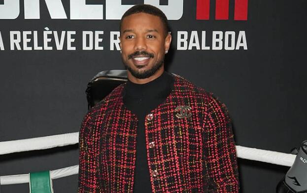 Michael B. Jordan Serves Up Preppy Style in Plaid Chanel Jacket & Shiny Leather Boots at ‘Creed III’ Photocall