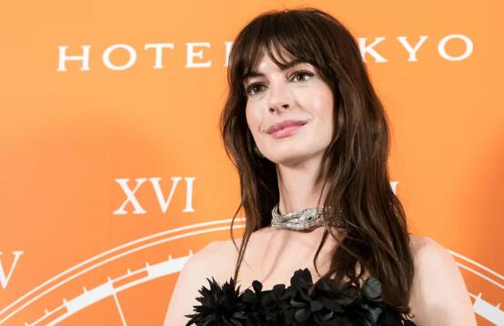 Anne Hathaway Pairs a Rosette Micro Minidress With Platform Heels