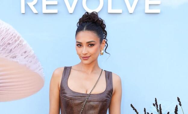 Shay Mitchell Takes on Lux Leather Trend With Corset Top & Knee-High Boots at Revolve Festival 2023 During Coachella