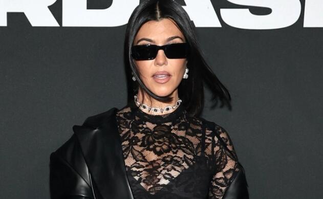 Kourtney Kardashian Slips Into Cowboy Boots and Mesh Tee Dress on the Blink-182 Tour Bus